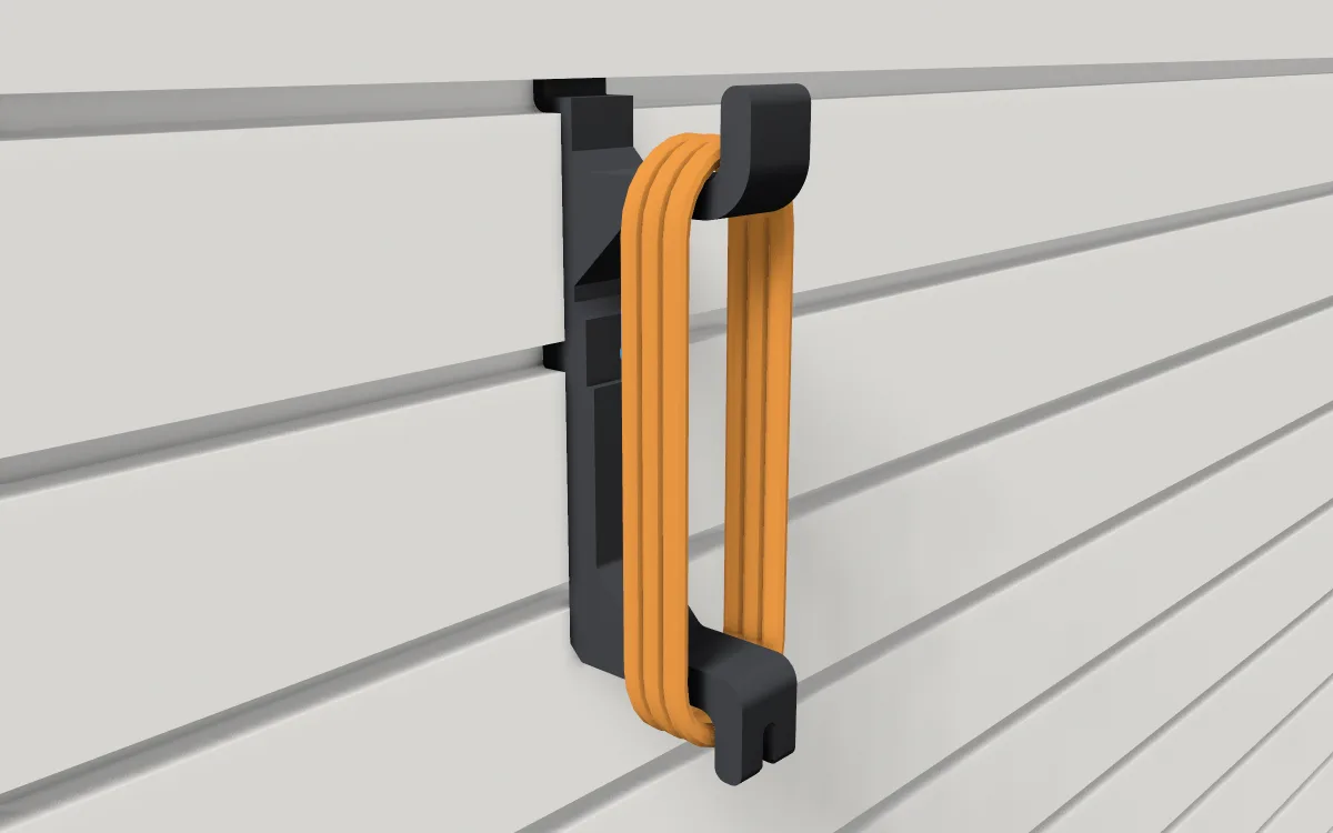 Extension-cord wrap on slatwall, holding a wound extension cord