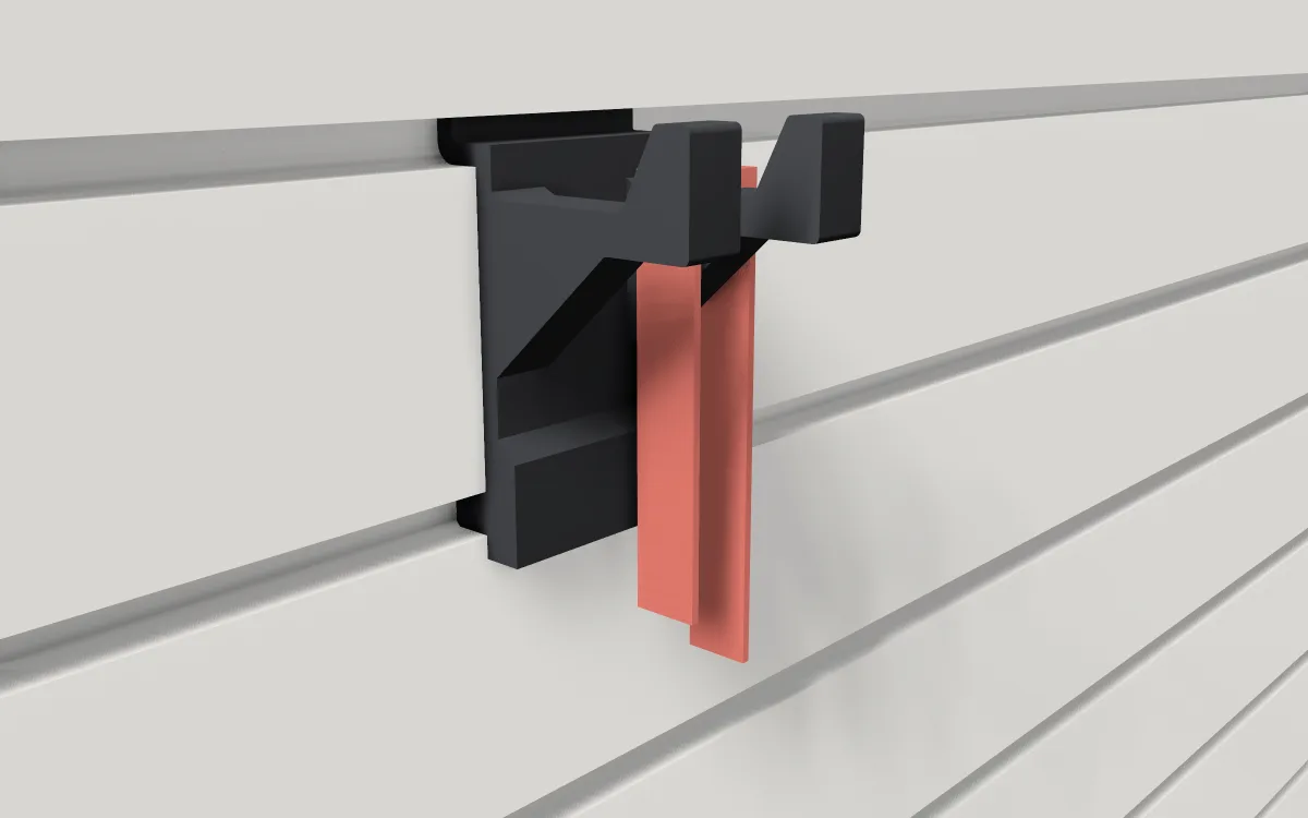 Double-prong hook on slatwall, holding garden gloves and a pair of glasses