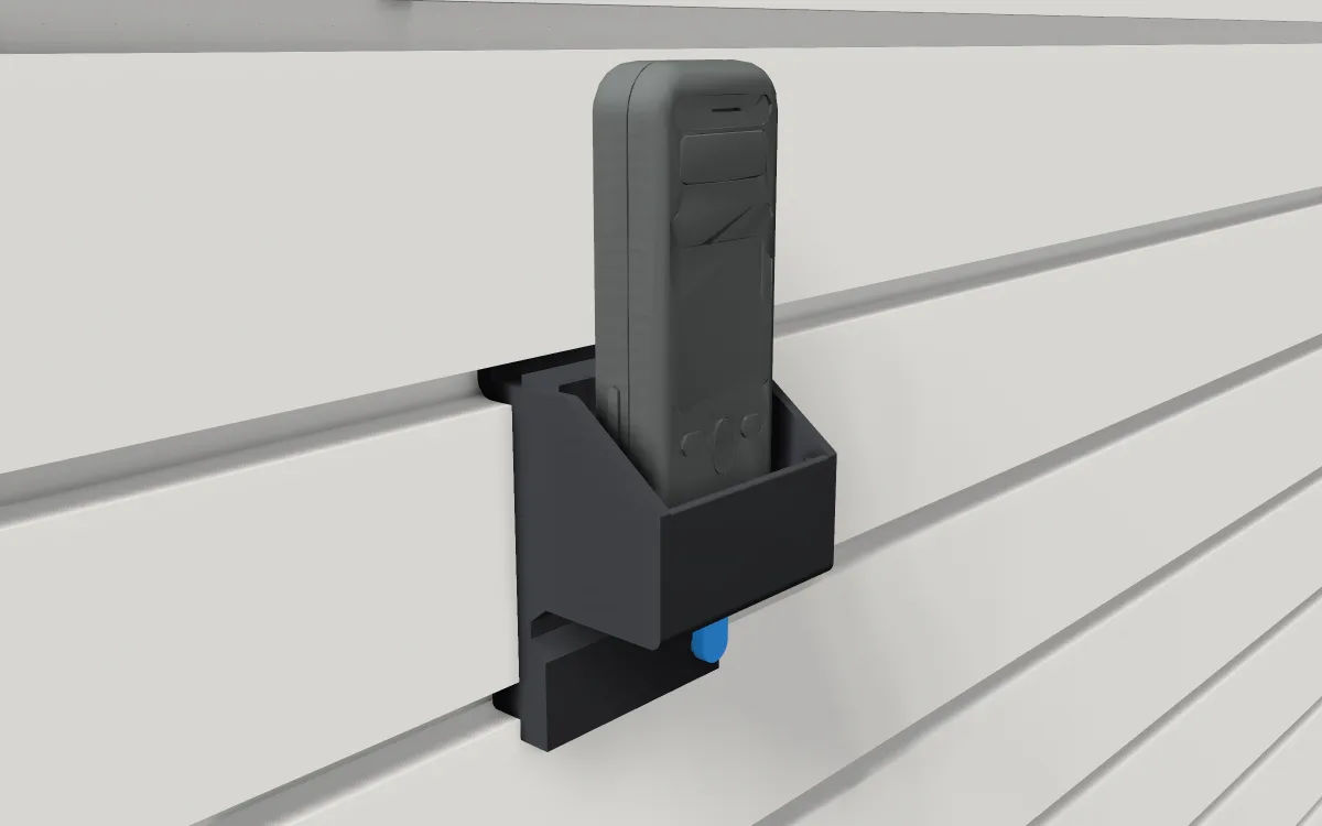 Laser-measure pocket on slatwall, holding a laser distance meter