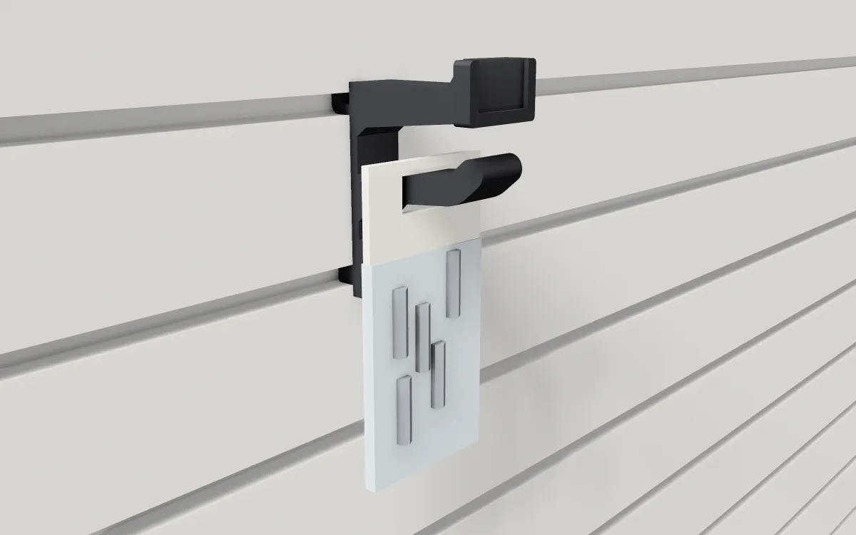 Scanner hook with label flag on slatwall, holding a bag of small parts