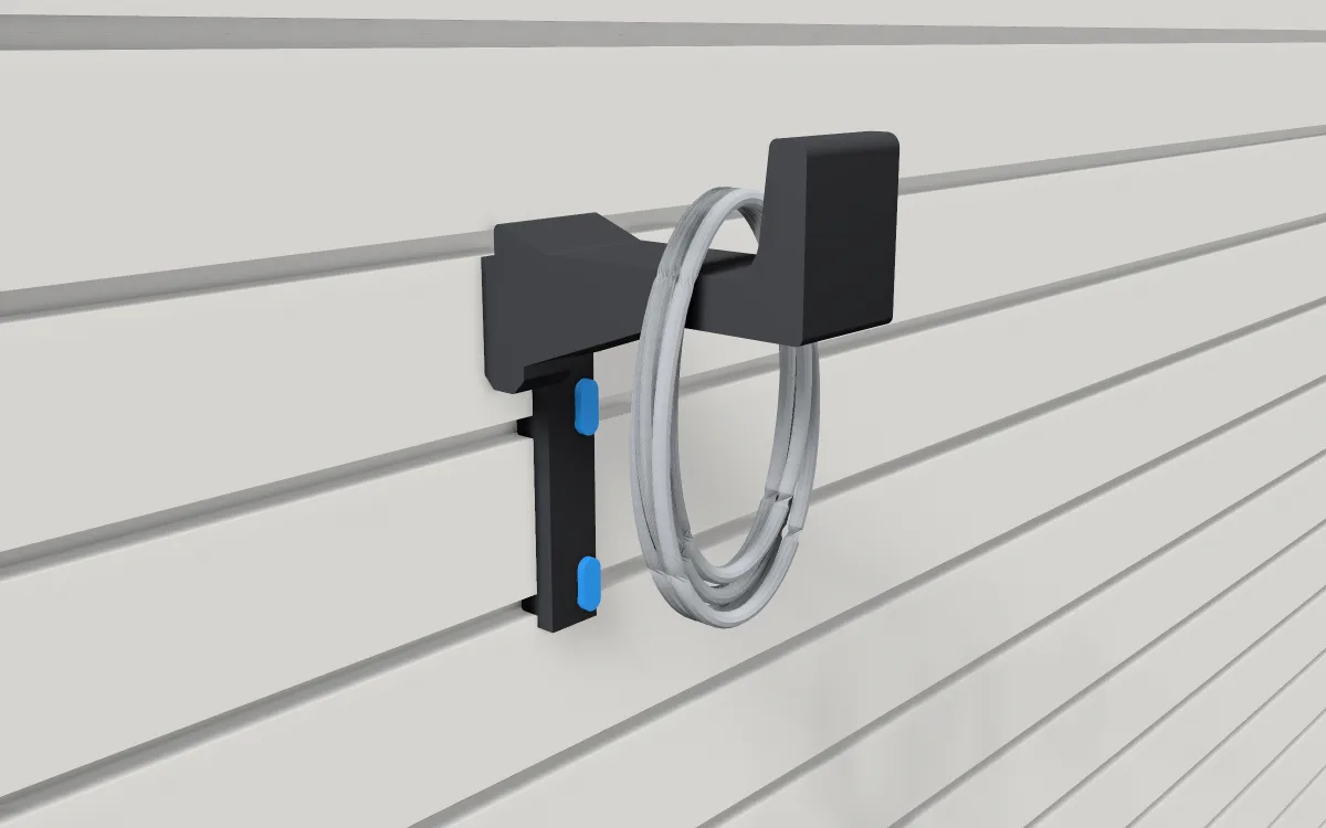 Extra-long hook on slatwall, holding a folded tarp